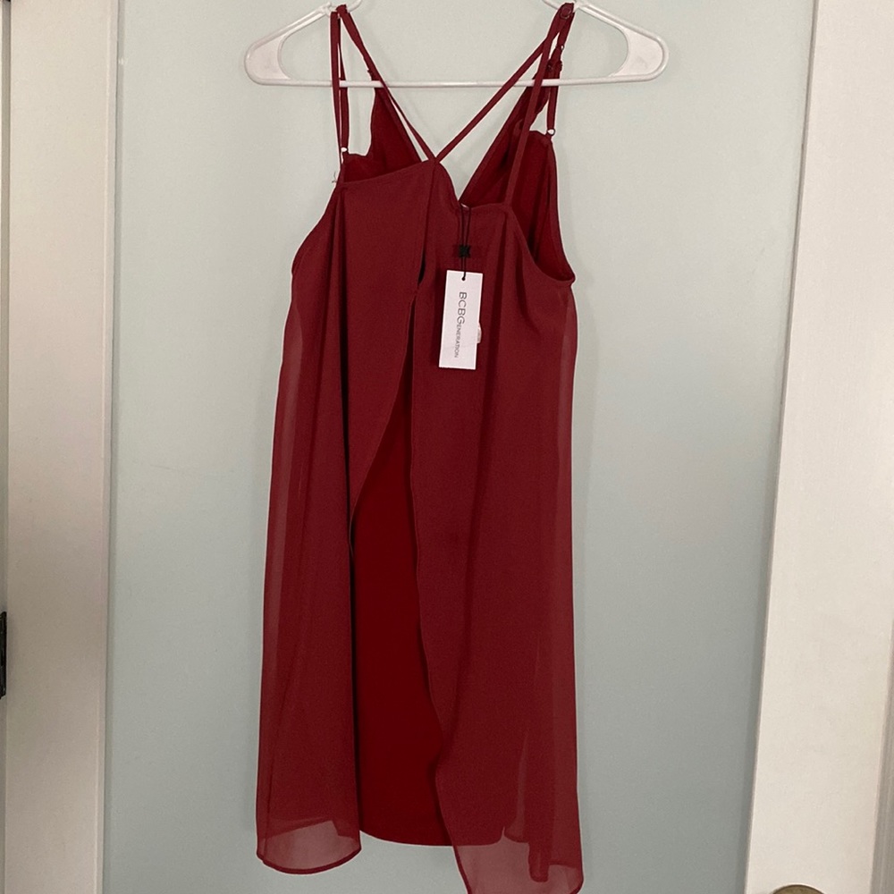It’s a light burgundy Mimi dress with open front and thin straps